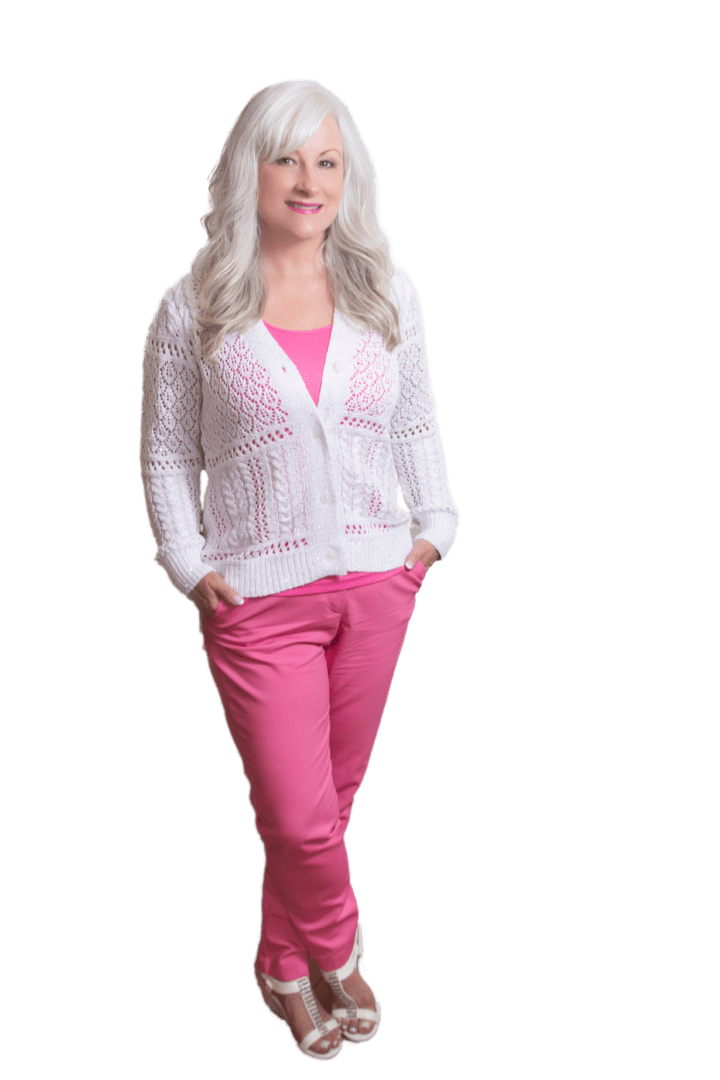 A woman in pink pants and white sweater.